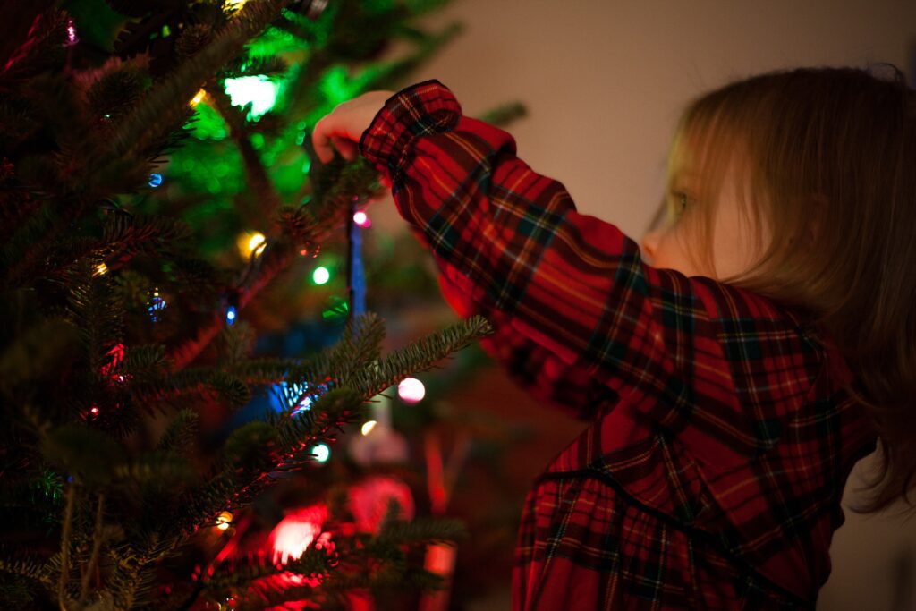 kids hanging Christmas decorations