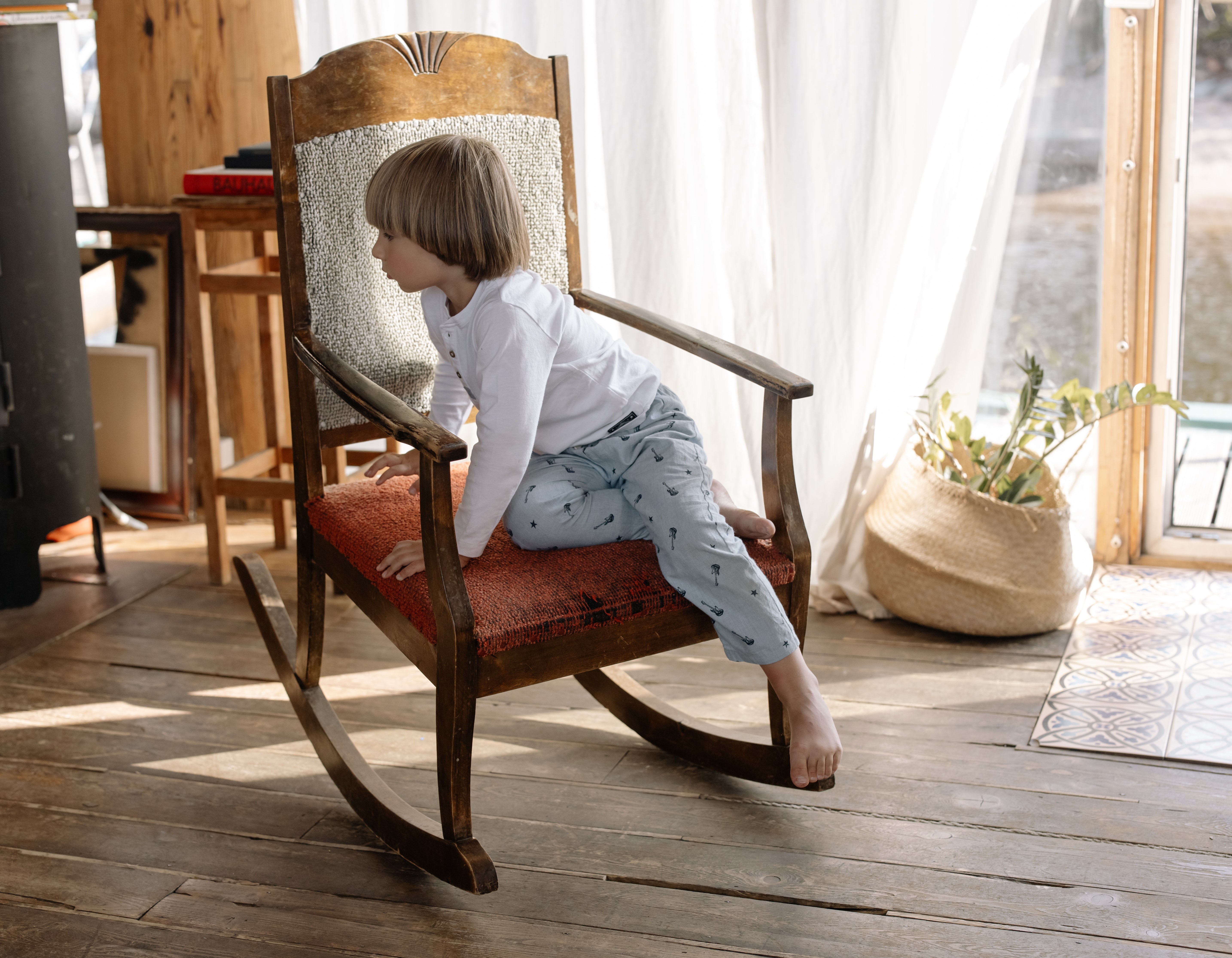 kids and babies in rocking chair