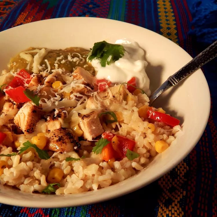 Baja style bowl with chicken, cheese, corn, salsa, red pepper