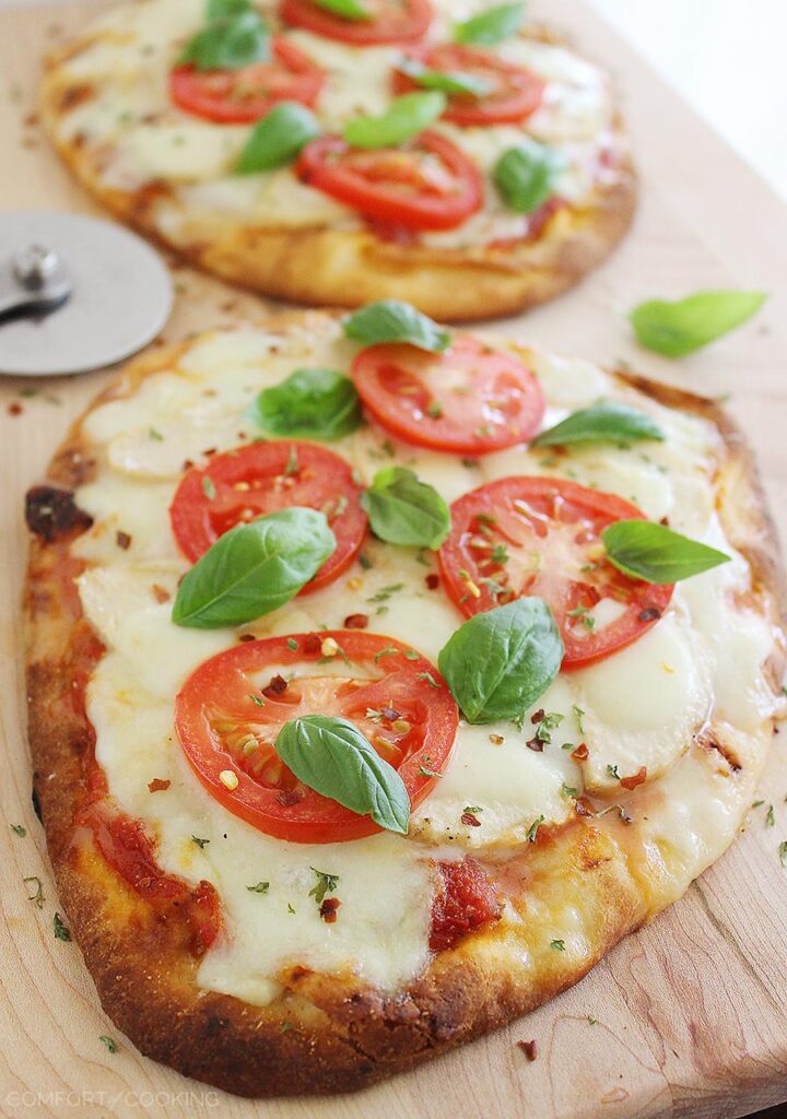 gourmet cheese Naan flatbread pizza with roma tomatoes and basil