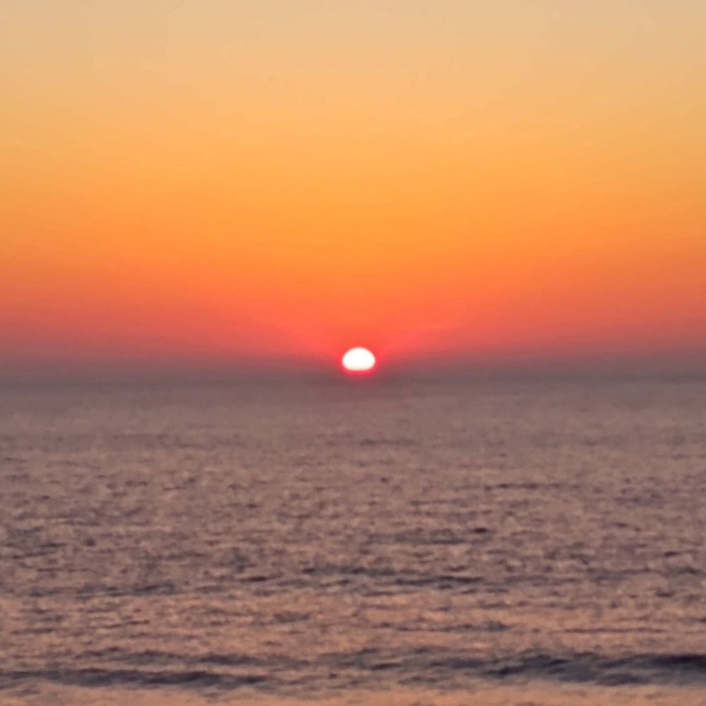 Boardwalk Plaza Hotel Oceanfront Queen Suite desk sunrise from balcony